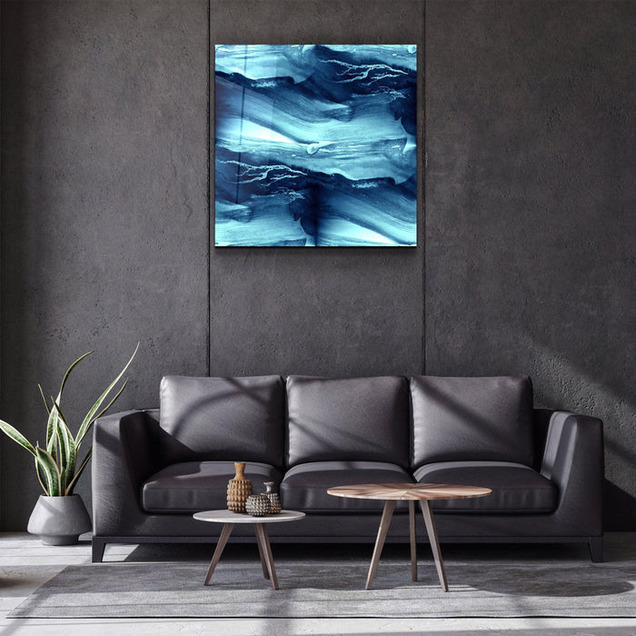 Abstract Waves glass wall art by Artdesigna featuring flowing wave patterns in clear and blue glass on a white background.