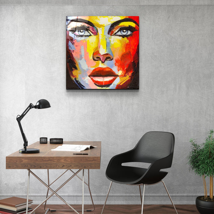 Abstract woman portrait glass wall art by Artdesigna, featuring a vibrant, artistic depiction of a woman's face on clear glass.