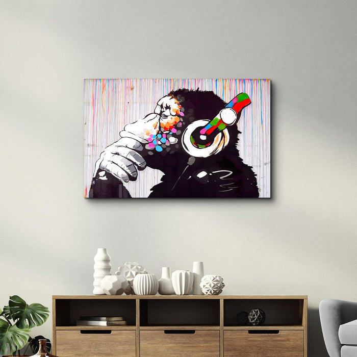 Banksy Monkey Beat glass wall art by Artdesigna featuring a colorful monkey design on sleek glass surface.
