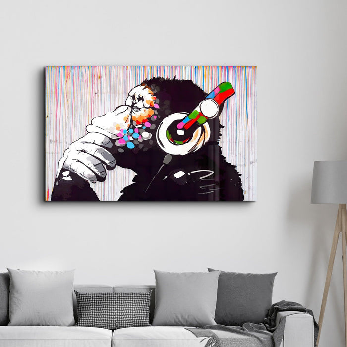 Banksy Monkey Beat glass wall art by Artdesigna featuring a vibrant monkey design on clear glass.