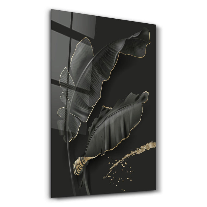Elegant black and gold feather glass wall art by Artdesigna, showcasing intricate details and vibrant colors on a sleek wall surface.