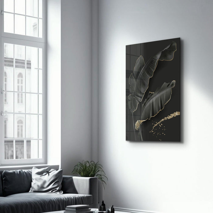 Black and gold feather glass wall art by Artdesigna, featuring intricate feather design on clear glass background.