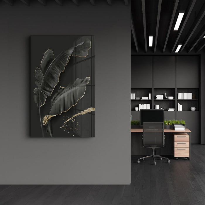 Black and gold feather glass wall art by Artdesigna, featuring intricate feather design on clear glass background.
