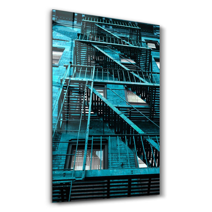 Colorful apartments glass wall art by Artdesigna featuring vibrant, abstract cityscape design on clear glass.