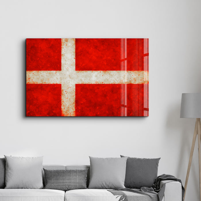 Glass wall art featuring the Denmark flag splash design by Artdesigna, with vibrant colors and textured glass surface.