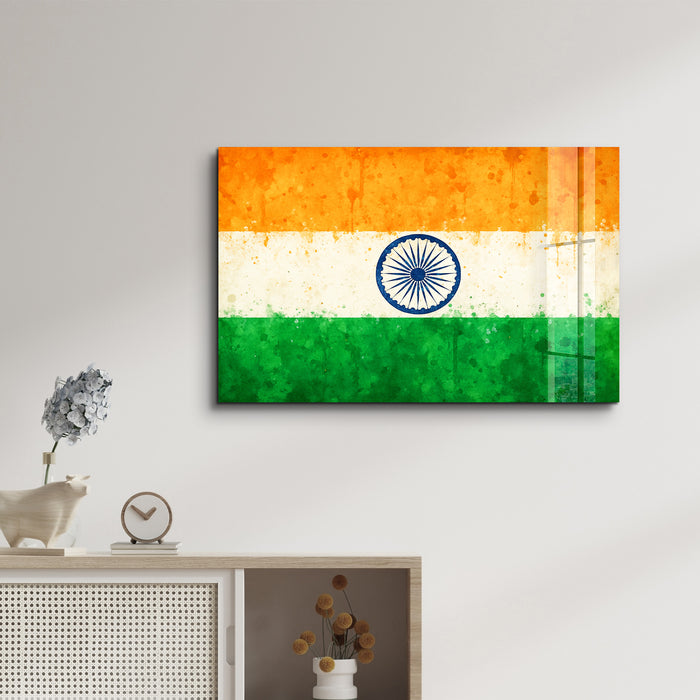 Glass wall art featuring an India flag splash design by Artdesigna, 16x10 inches, vibrant and modern wall decor.