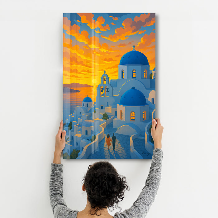 Glass wall art by Artdesigna depicting a Santorini sunset scene, with vibrant colors and scenic island views.
