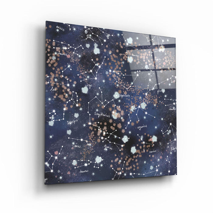 Glass wall art featuring stars and zodiac symbols by Artdesigna, showcasing intricate designs on clear glass.