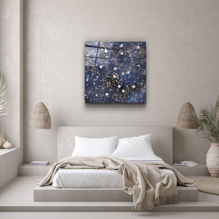 Glass wall art featuring stars and zodiac symbols by Artdesigna, showcasing intricate celestial designs on a sleek glass panel.