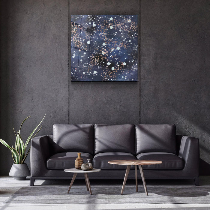Elegant glass wall art featuring stars and zodiac symbols by Artdesigna, showcasing intricate designs on a transparent glass panel.