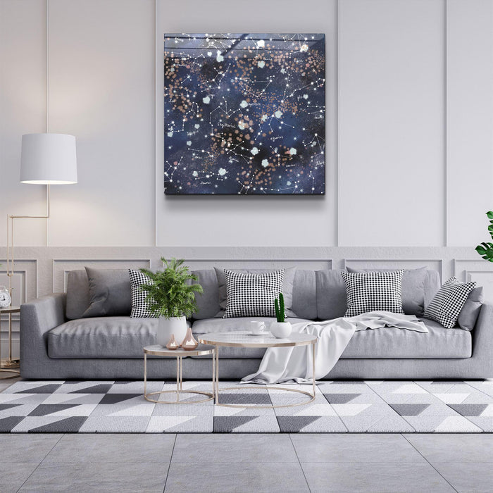 Glass wall art featuring stars and zodiac symbols, decorative design by Artdesigna, mounted on a wall.