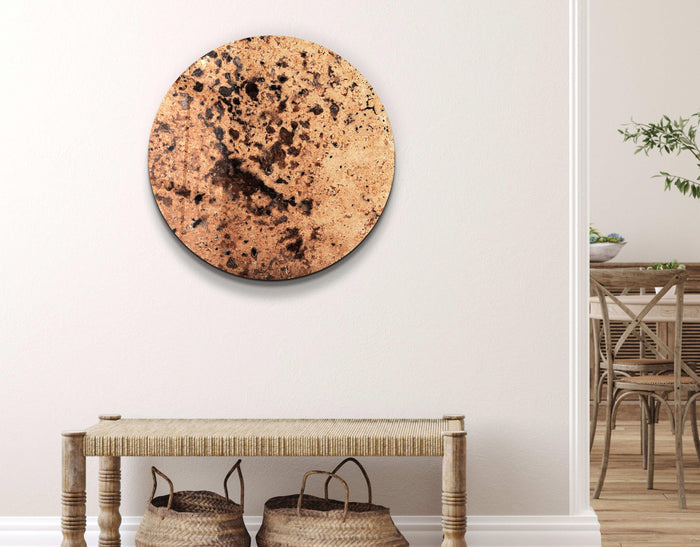 Brown stone with embedded crystals in rounded glass wall art by Artdesigna, showcasing a smooth, artistic design for interior decor.